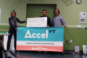Flexible Capital Fund President Janice St. Onge (left) and VSJF Director of Business Assistance Geoff Robertson (right) present Sadoc Paredes of AgHelp with a check for $25,000 as one of two winners of Accel-VT Ag & Food Tech 2018.
