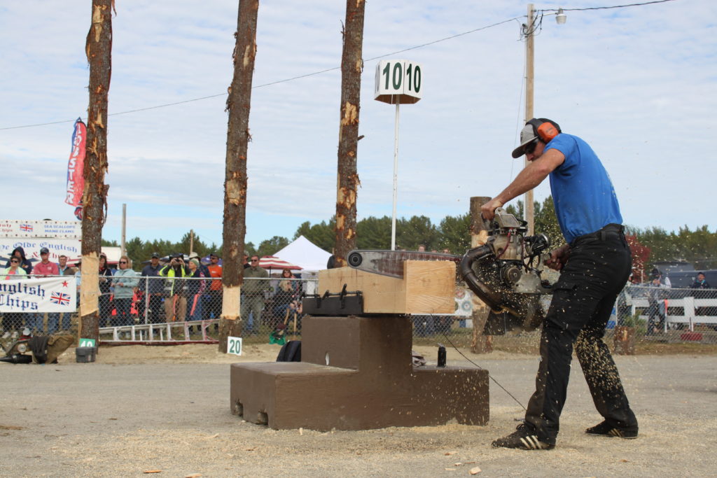 Calvin Willard competes in the hot saw event at the 2019 Fryeburg Fair Woodsmen's Day in Maine.