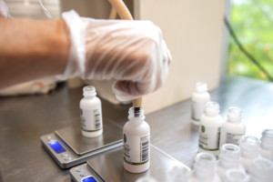 Employee Lori Bullett works in the Luce Farm Wellness production facility in Bethel. Photo by Erica Houskeeper.