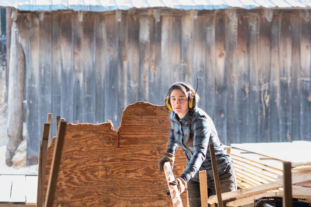 Employee Lucy Rogers’ job responsibilities include running the debarker, driving the forwarder, or pulling orders. Photo by Erica Houskeeper.