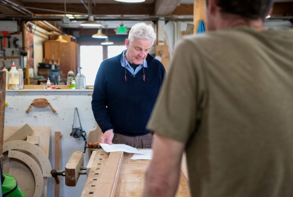 Charlie Shackleton consults with an employee at ShackletonThomas in Bridgewater. Photo by Erica Houskeeper.