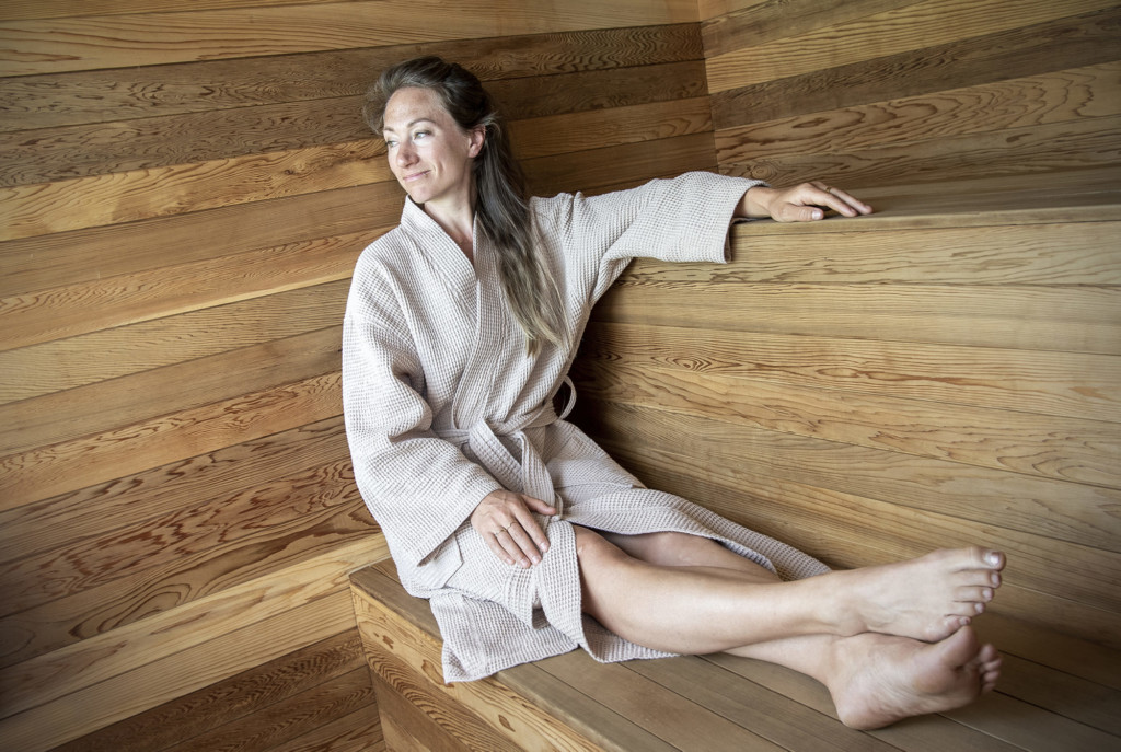 Savu co-founder Nicole Sweeney, an architect by training, relaxes in a Savu sauna outside of Hula in Burlington. Photo by Erica Houskeeper.