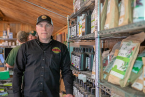 Jeremy Deschaine, general manager of Vermont Hempicurean in West Brattleboro, with products in the Vermont Grow Barn. Photo by Erica Houskeeper.