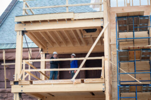 Megan Nedzinski of Vermont Integrated Architecture tours an upper floor of the museum’s addition with Adam Kane. Photo by Erica Houskeeper.