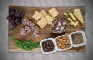 A Babette’s Table artisanal charcuterie spread paired with local cheese, mustard, jam and almonds. Photo by Erica Houskeeper.