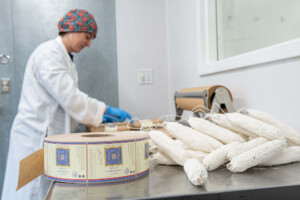 Julie Morton packages dried pork sausage at Babette’s Table in Waitsfield. Photo by Erica Houskeeper.