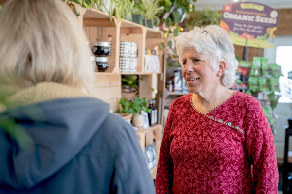 Business coach Jean Kissner advises Karin Bellemare, owner of The Roots Farm Market. Photo by Erica Houskeeper.