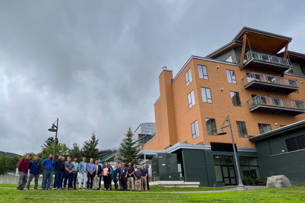 Project partners including representatives from Jay Peak Resort, public utilities, and contractors gather to celebrate the launch of the new electric boiler system that will reduce energy costs and carbon emissions. Photo by Kelly Nottermann.