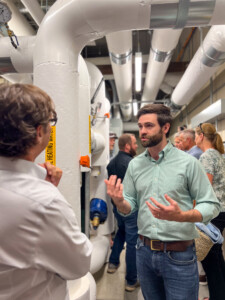 Jordan Kearns, Medley Thermal founder and CEO, Head of Business Operations at Antora Energy Inc., discusses the install of a new energy system at Jay Peak with Geoff Robertson, DeltaClimeVT Managing Director. Photo by Kelly Nottermann.