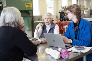 Amanda Kievet and Peggy Allen meet with business coach Carolyn Cooke, right, at Junction Fiber in White River Junction. Photo by Erica Houskeeper.