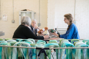 Amanda Kievet and Peggy Allen meet with business coach Carolyn Cooke, right, at Junction Fiber in White River Junction. Photo by Erica Houskeeper.