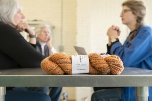 Amanda Kievet and Peggy Allen meet with business coach Carolyn Cooke, right, at Junction Fiber in White River Junction. Photo by Erica Houskeeper.