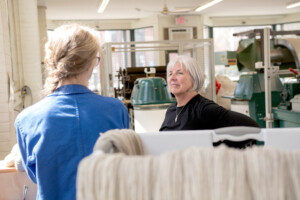 Amanda Kievet and Peggy Allen meet with business coach Carolyn Cooke, right, at Junction Fiber in White River Junction. The two sought out the VSJF Business Coaching program to drill down on the true cost of their product, which was a first step to entering the wholesale market. Photo by Erica Houskeeper.