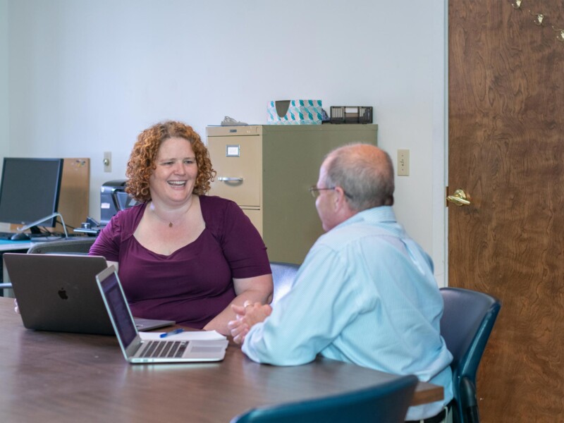 Claire Georges, owner of Butterfly Bakery in Barre, meets with business coach Lawrence Miller. Butterfly Bakery produces its signature hot sauces along with other branded hot sauces and specialty foods. Photo by Erica Houskeeper.