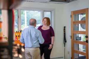 Claire Georges, owner of Butterfly Bakery in Barre, meets with business coach Lawrence Miller. Butterfly Bakery produces its signature hot sauces along with other branded hot sauces and specialty foods. Photo by Erica Houskeeper.