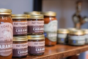 Fat Toad Farm caramel products are displayed in the Butterfly Bakery retail store in Barre. Georges purchased Fat Toad Farm in 2022. Photo by Erica Houskeeper.