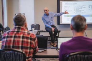 Joeseph Steig, director or ecosVC Venture Studio, facilitates a discussion with participants at the 2023 Forest Accelerator in East Burke. Photo by Erica Houskeeper