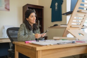 Employee Eliana Cabrera at New Frameworks. As a worker-owned cooperative, the company has taken a people-first approach from day one. Photo by Erica Houskeeper.