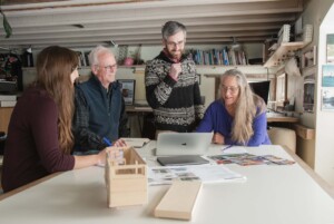 RJ Adler, director of growth at Wheelpad, meets with Victor Morrison, Luella Strattner, left, and Julie Lineberger right. Photo by Erica Houskeeper.