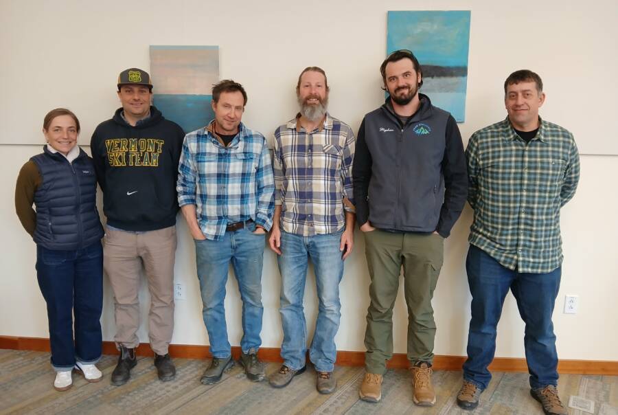 The 2026 cohort of Tools of the Trade – Business Coaching for Energy Pros gathered for a recent work session in Waterbury, VT. From left to right: Sarah and Will Reed of Vermont Foam Insulation, Eric Solsaa of Solsaa Building and Energy Solutions, Martin Bean of Earthshare Construction, Stephen Perkins of Peak Efficiency, and Steven Gruner of Gruner Builders. Not pictured: Colin Doolittle of On the Dot HVAC, and Adam and Tara Lang of Lang Air Conditioning and Refrigeration. Photo courtesy of Vermont Sustainable Jobs Fund.
