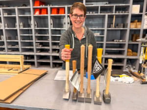 Gina Akley shows off some of Trow & Holden's tools. 